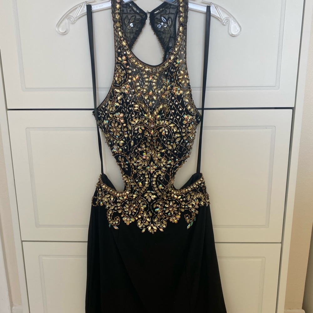 Black halter dress with iridescent sequins. Homecoming or cocktail party.